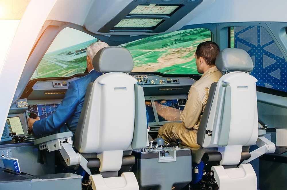 Pilots training in a flight simulator