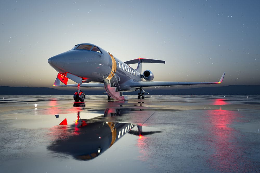 A private jet waits for a nighttime departure