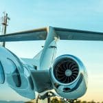 A close-up view of a private jet on a runway