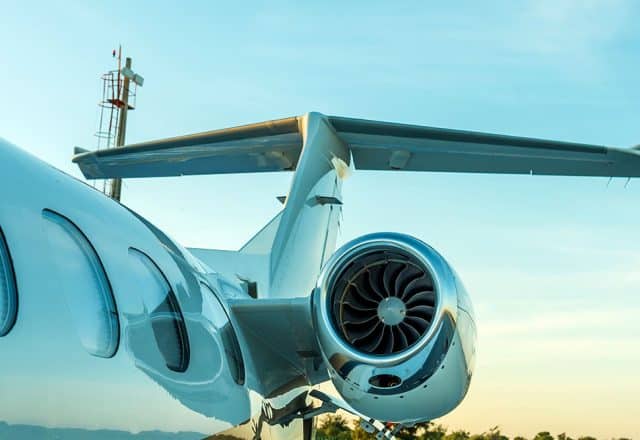 A close-up view of a private jet on a runway