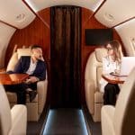 Two business people on a private jet