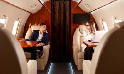 Two business people on a private jet