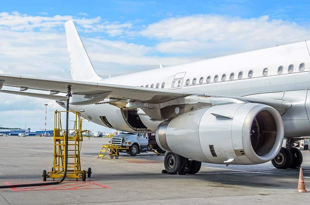 A commercial jet getting fueled