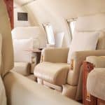 An interior view of a luxurious private jet cabin.